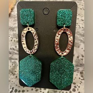 Handmade resin art. Including earrings, necklaces, pins, coasters etc